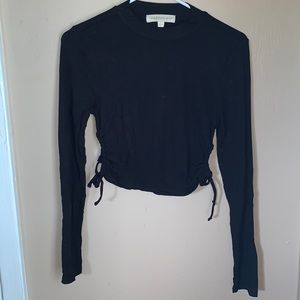 Black top with holes on side